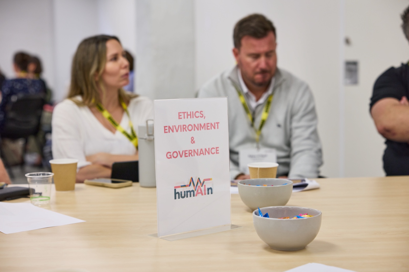 Roundtable discussion with an Ethics, Environment & Governance table sign in the foreground