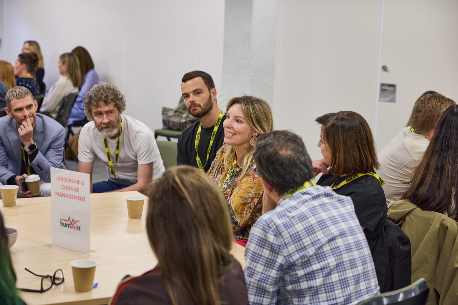 Group of delegates engaged in discussion at a Leadership & Change Management roundtable
