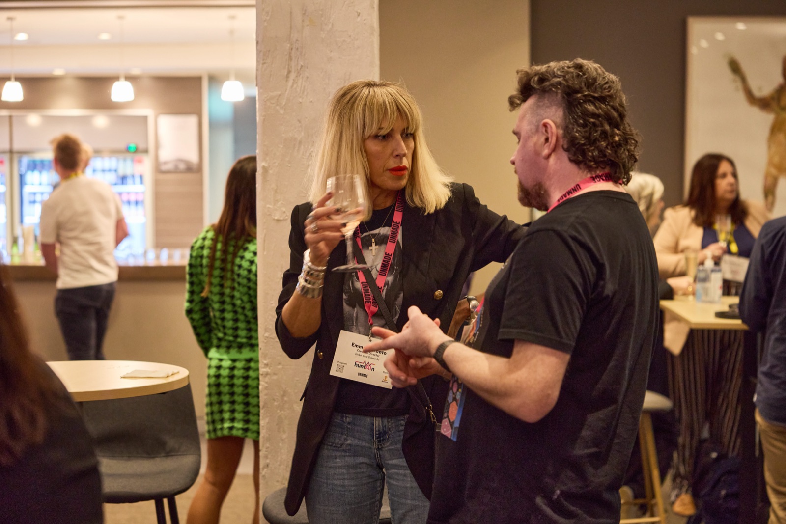 Two delegates in conversation during the networking drinks