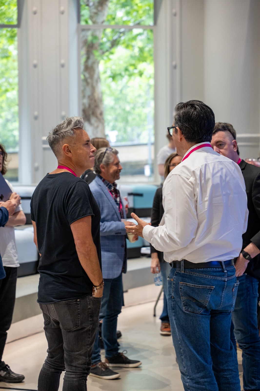 Delegates talking in a group in the venue during a break