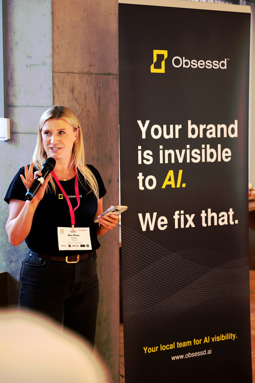 Bec Penn, Founder of Obsessd, speaking with a microphone